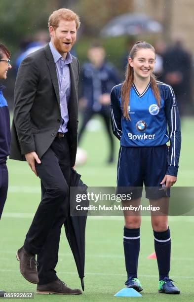 Prince Harry watches a football training session during a visit to the Sir Tom Finney Soccer Development Centre at the UCLan Sports Arena on October...