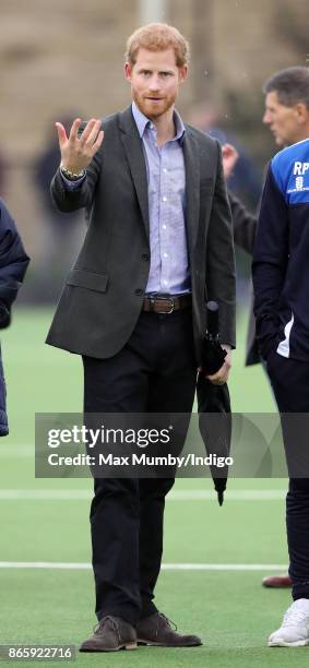 Prince Harry watches a football training session during a visit to the Sir Tom Finney Soccer Development Centre at the UCLan Sports Arena on October...