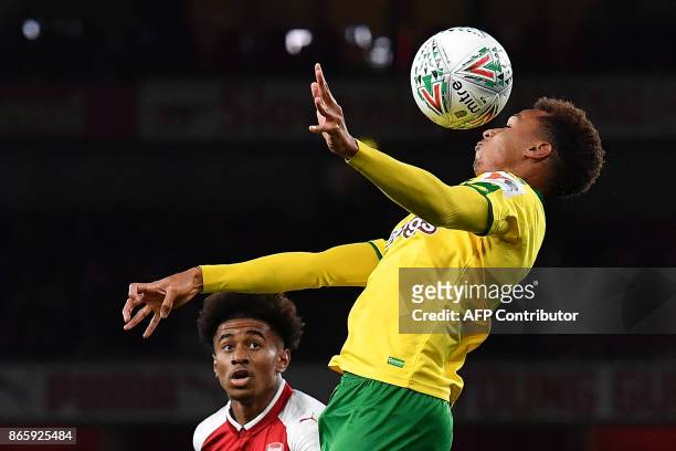Arsenal's English midfielder Reiss Nelson vies with Norwich City's English midfielder Josh Murphy during the English League Cup fourth round football...