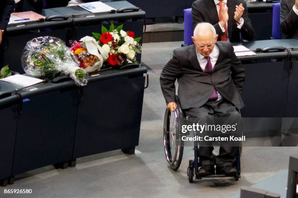 Newly elected Bundestag president Wolfgang Schaeuble moves to the President seat at the opening session of the new Bundestag on October 24, 2017 in...