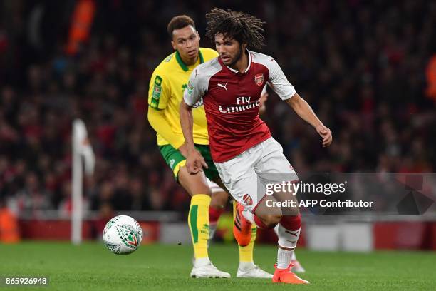 Norwich City's English midfielder Josh Murphy vies with Arsenal's Egyptian midfielder Mohamed Elneny during the English League Cup fourth round...