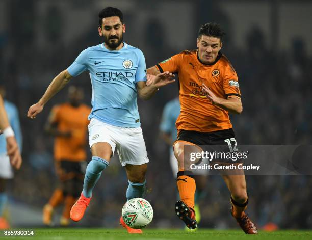 Ilkay Gundogan of Manchester City and Ben Marshall of Wolverhampton Wanderers battle for the ball during the Carabao Cup Fourth Round match between...