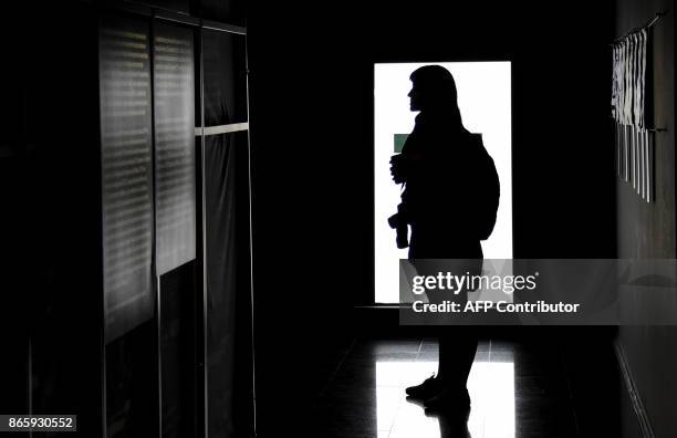 Woman visits "Secrets of State: the Declassified History of the Chilean Dictatorship" exhibition at the Museum of Memory and Human Rights in Santiago...