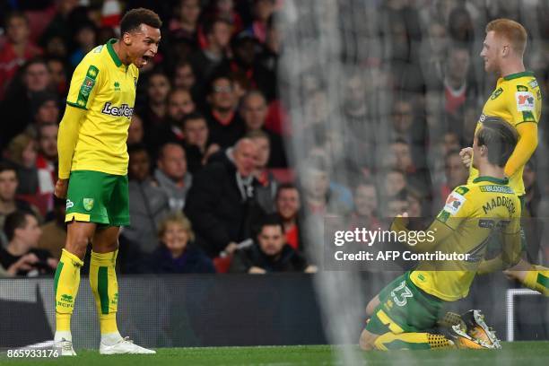 Norwich City's English midfielder Josh Murphy celebrates scoring the opening goal during the English League Cup fourth round football match between...