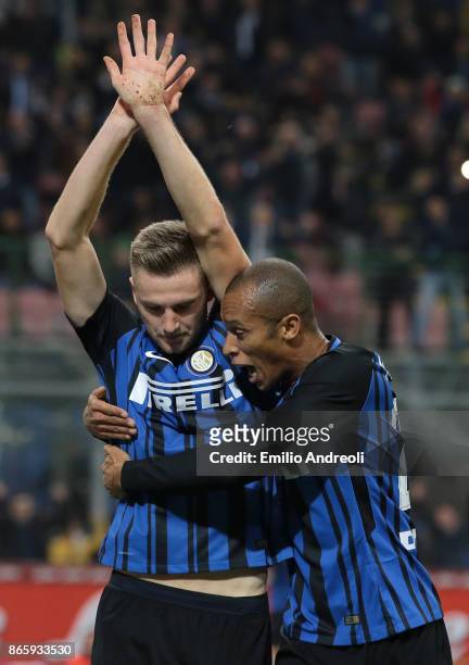 Milan Skriniar of FC Internazionale Milano celebrates with his team-mate Joao Miranda de Souza Filho after scoring the opening goal during the Serie...