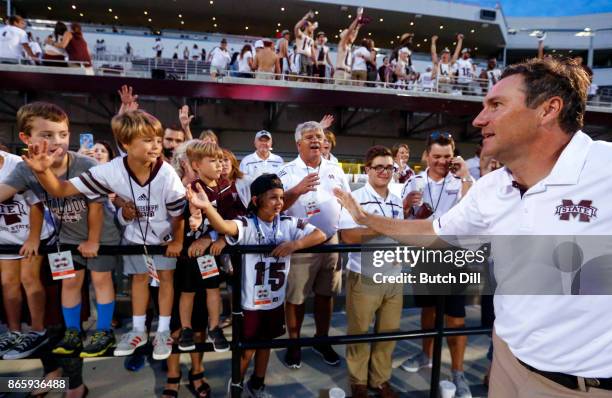 Head coach Dan Mullen of the Mississippi State Bulldogs greets fans after they defeated the Kentucky Wildcats 45-7 in an NCAA football game at Davis...