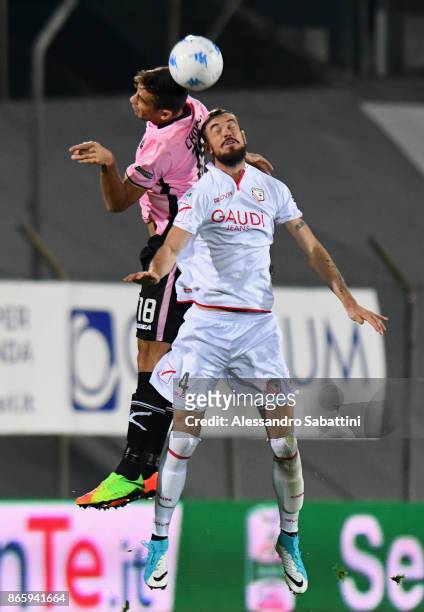Ivaylo Chochev of US Citta di Palermo competes for the ball with Alessio Sabbione of FC Carpi during the Serie B match between FC Carpi and US Citta...