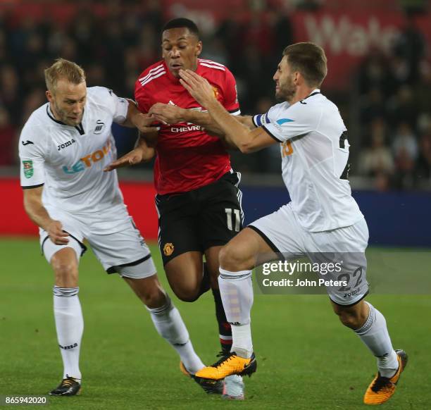 Anthony Martial of Manchester United in action with Mike van der Hoorn and Angel Rangel of Swansea City during the Carabao Cup Fourth Round match...