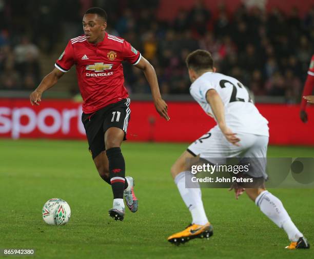 Anthony Martial of Manchester United in action with Angel Rangel of Swansea City during the Carabao Cup Fourth Round match between Swansea City and...