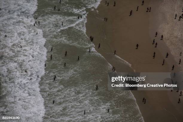 aerial views of rio - beach goers stock pictures, royalty-free photos & images