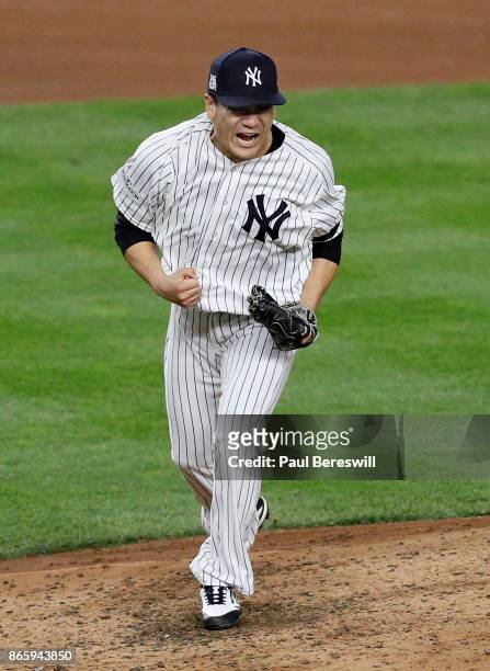Pitcher Masahiro Tanaka of the New York Yankees reacts in the fifth inning of game 5 of the American League Championship Series against the Houston...
