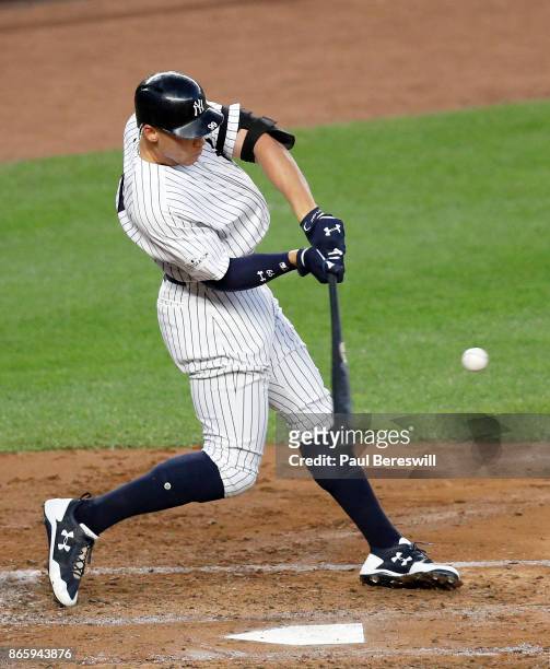 Aaron Judge of the New York Yankees hits a double to drive in Brett Gardner in the third inning of game 5 of the American League Championship Series...