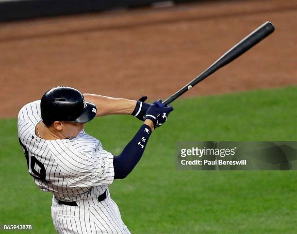 Aaron Judge of the New York Yankees hits a double to drive in Brett Gardner in the third inning of game 5 of the American League Championship Series...