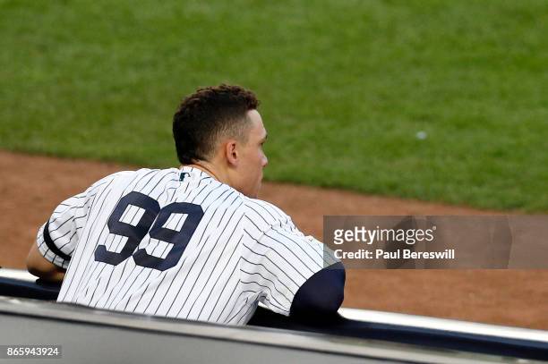 Aaron Judge of the New York Yankees watches his team batting in the second inning of game 5 of the American League Championship Series against the...
