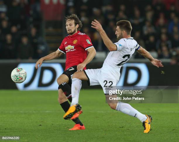 Daley Blind of Manchester United in action with Angel Rangel of Swansea City during the Carabao Cup Fourth Round match between Swansea City and...