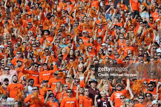 Fans of the Virginia Tech Hokies jump up and down during "Enter Sandman" prior to the game against the North Carolina Tar Heels at Lane Stadium on...