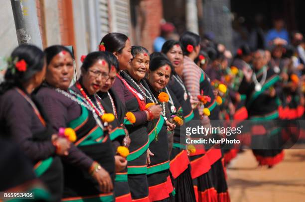 Newari community people in a traditional attire lining by holding flowers to welcome President Bidhya Devi Bhandari during inauguration ceremony of...
