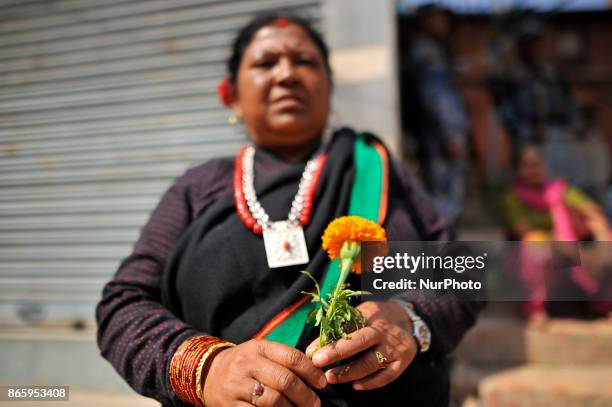 Newari community people in a traditional attire lining by holding flowers to welcome President Bidhya Devi Bhandari during inauguration ceremony of...