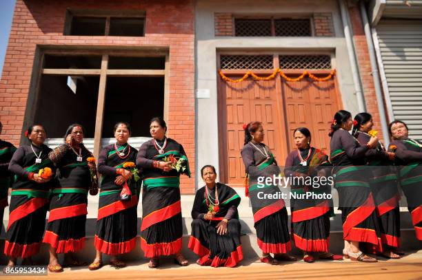 Newari community people in a traditional attire lining by holding flowers to welcome President Bidhya Devi Bhandari during inauguration ceremony of...