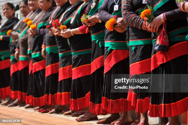 Newari community people in a traditional attire lining by holding flowers to welcome President Bidhya Devi Bhandari during inauguration ceremony of...