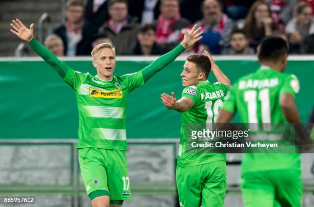 Thorgan Hazard of Borussia Moenchengladbach celebrate after he scores his teams first goal with team mates during the DFB Cup match between Fortuna...