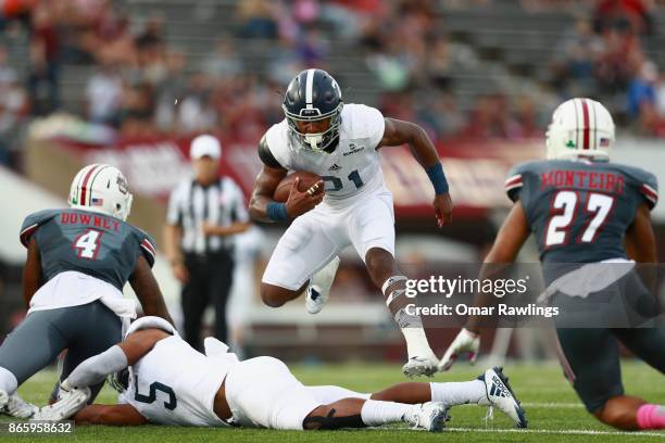 Running back Wesley Fields of the Georgia Southern Eagles leaps a downed player during the first half of the game against the Massachusetts Minutemen...