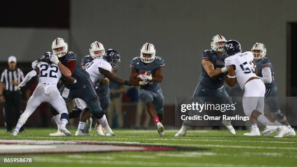 Running back Nick Orekoya of the Massachusetts Minutemen rushes against the against the Georgia Southern Eagles during the second half game at...