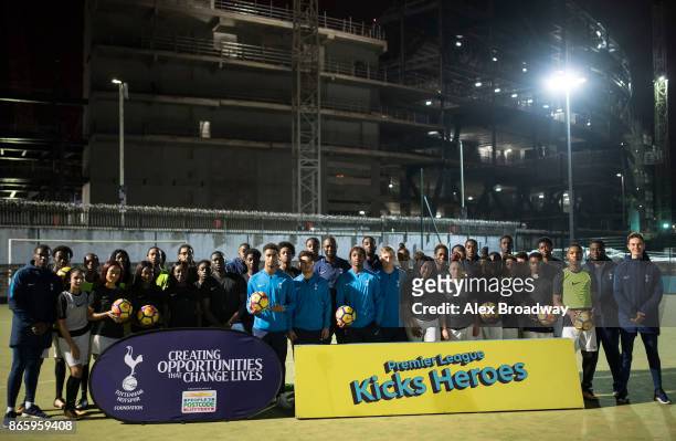 Premier League Kicks participants pose for a photograph with Ledley King, Tottenham Hotspur Foundation ambassador during a Premier League Kicks...