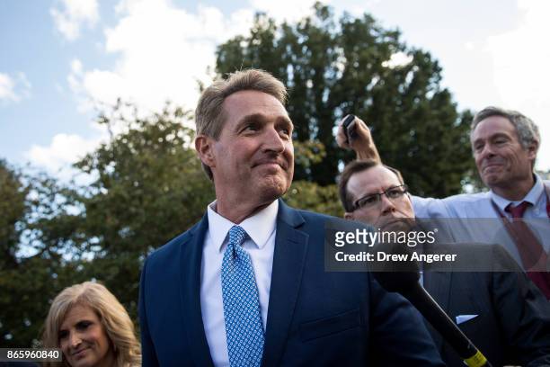 Sen. Jeff Flake and his wife Cheryl Flake leave the U.S. Capitol as they are trailed by reporters, October 24, 2017 in Washington, DC. Flake...