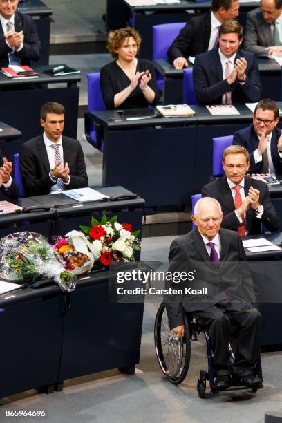 Newly elected Bundestag president Wolfgang Schaeuble moves to the President seat at the opening session of the new Bundestag on October 24, 2017 in...