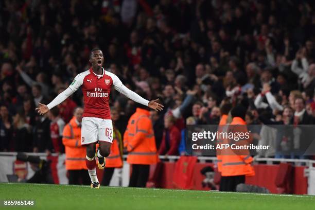 Arsenal's English striker Eddie Nketiah celebrates scoring his team's second goal in the first half of extra time during the English League Cup...