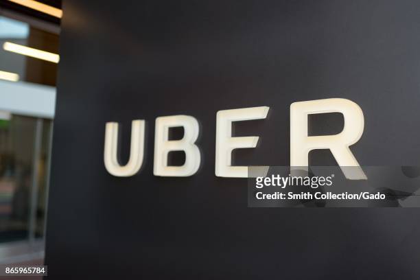 Sign with logo at the headquarters of car-sharing technology company Uber in the South of Market neighborhood of San Francisco, California, October...