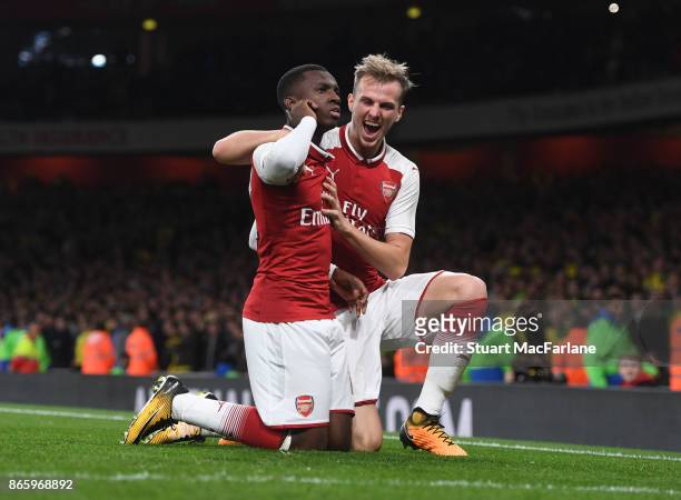 Eddie Nketiah celebrates scoring the 2nd Arsenal goal with Rob Holding during the Carabao Cup Fourth Round match between Arsenal and Norwich City at...
