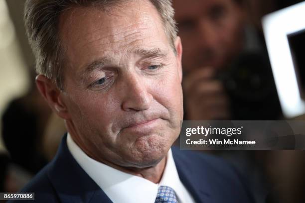 Sen. Jeff Flake speaks to reporters after announcing he will not seek re-election October 24, 2017 in Washington, DC. Flake announced that he will...
