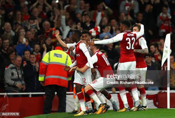 Edward Nketiah of Arsenal celebrates with team mates after scoring his sides second goal during the Carabao Cup Fourth Round match between Arsenal...