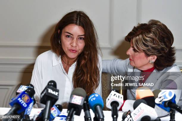 Mimi Haleyi , a former production assistant, flanked by her lawyer Gloria Allred, speaks during a press conference in New York on October 24, 2017...