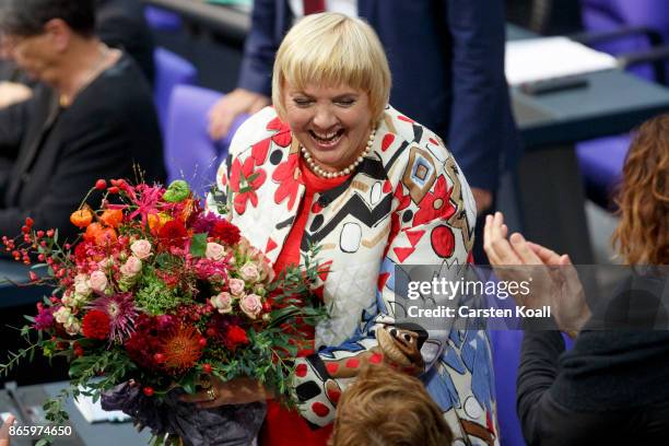 Newly-elected Bundestag Vice-President Claudia Rot holds flowers shortly after he was elected at the opening session of the new Bundestag on October...