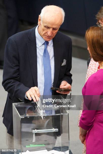 Albrecht Glaser of the right-wing Alternative for Germany puts his vote in a ballot box for the election of the new President of the Bundestag during...