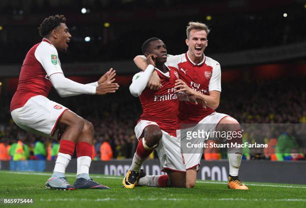 Eddie Nketiah celebrates scoring the 2nd Arsenal goal with Rob Holding and Alex Iwobi during the Carabao Cup Fourth Round match between Arsenal and...