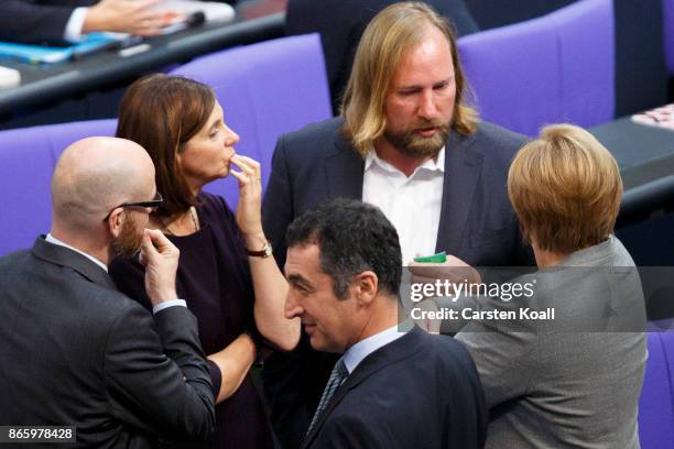 Secretary-General of the German Christian Democrats , Peter Tauber, co-leaders of the German Greens Party Katrin Goering-Eckardt and Cem Ozdemir,...