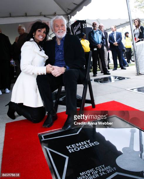 Kenny Rogers poses with wife Wanda Miller as he is inducted into the Nashville Music City Walk of Fame on October 24, 2017 in Nashville, Tennessee.