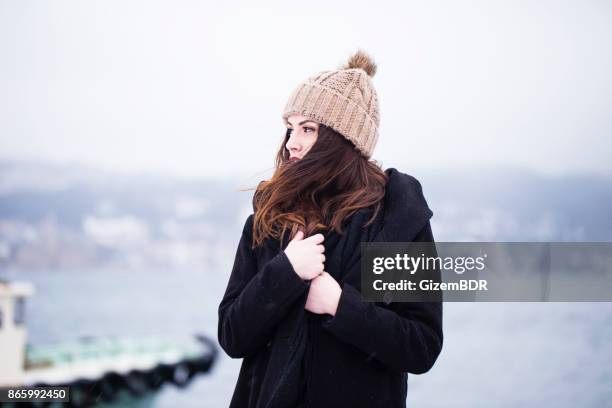 beautiful woman in winter clothing - hair fashion stock pictures, royalty-free photos & images
