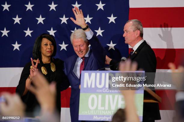 Former president Bill Clinton greets to attendees next Democratic candidate Phil Murphy, who is running for the governor of New Jersey during a rally...