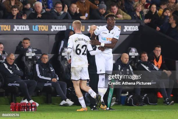 Oliver McBurnie of Swansea City is replaced by Tammy Abraham of Swansea City during dthe Carabao Cup Fourth Round match between Swansea City and...