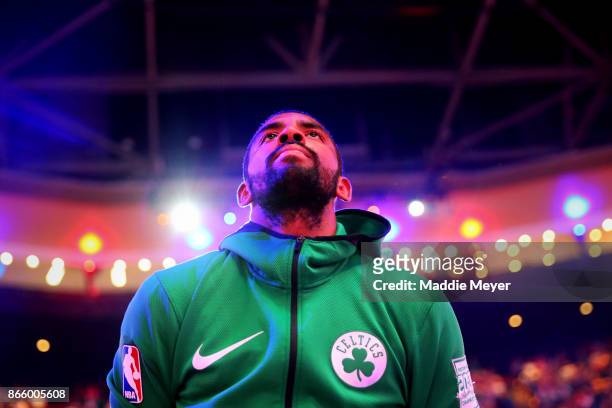 Kyrie Irving of the Boston Celtics looks on during the singing of the national anthem before the game against the New York Knicks at TD Garden on...