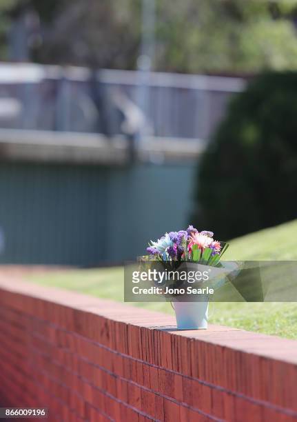 Single bunch of flowers are seen outside the entrance to Dreamworld on October 25, 2017 in Gold Coast, Australia. Four people were killed following...