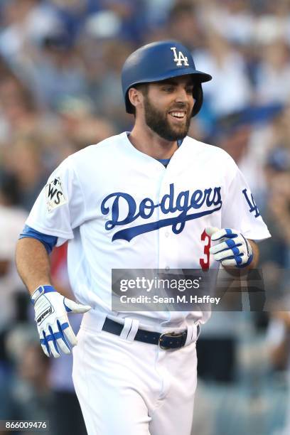 Chris Taylor of the Los Angeles Dodgers celebrates after leading off the first inning with a solo home run against the Houston Astros in game one of...