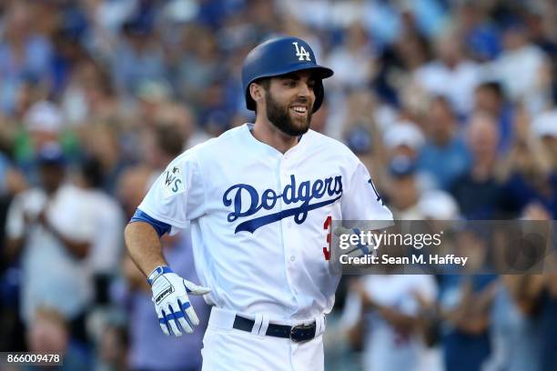 Chris Taylor of the Los Angeles Dodgers celebrates after leading off the first inning with a solo home run against the Houston Astros in game one of...