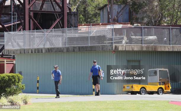 Staff can be seen near the closed Thunder River Rapids ride at Dreamworld on October 25, 2017 in Gold Coast, Australia. Four people were killed...