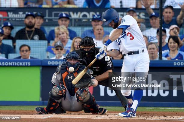 Chris Taylor of the Los Angeles Dodgers hits a solo home run during the first inning against the Houston Astros in game one of the 2017 World Series...